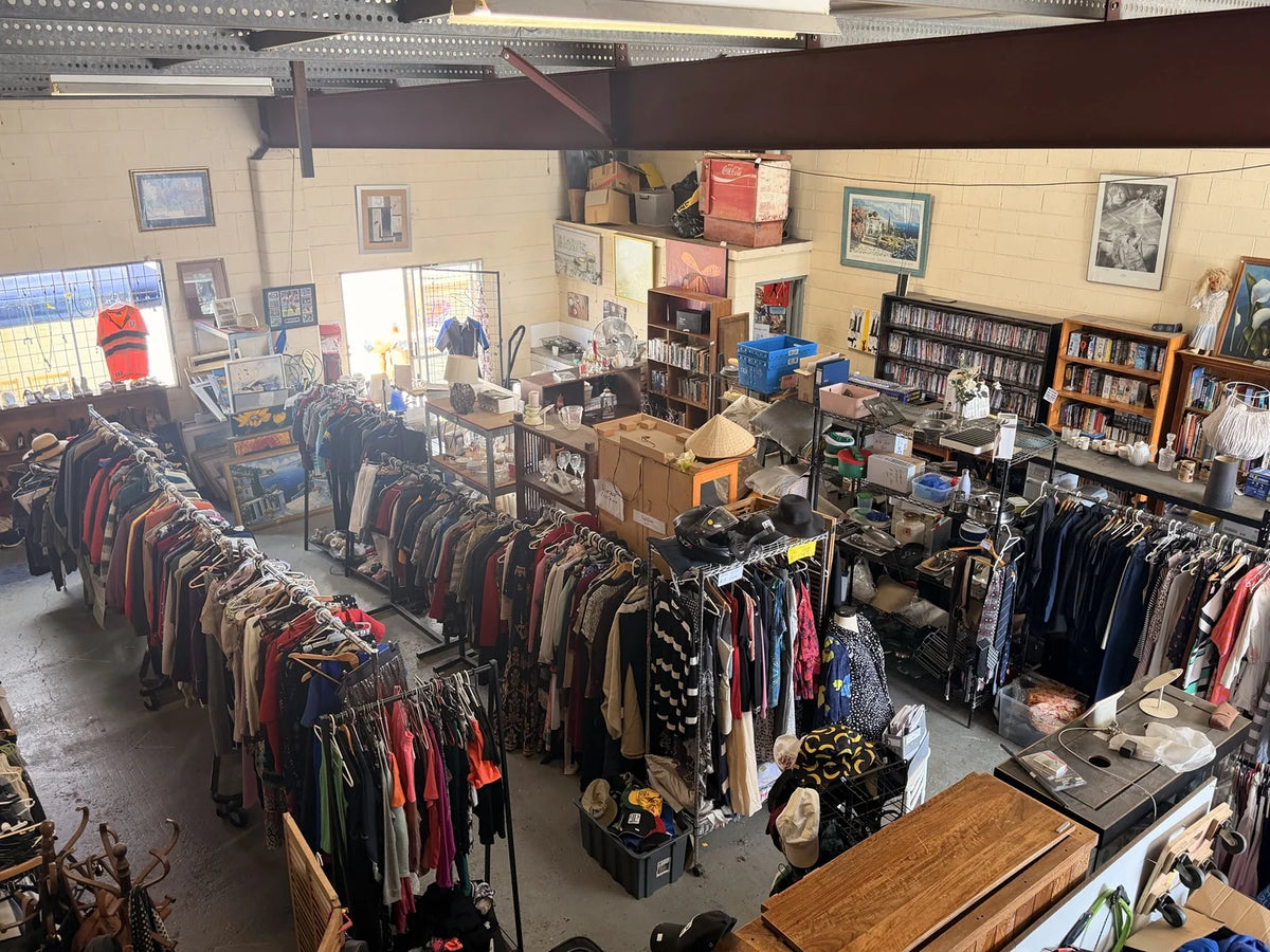 An overhead view inside Bunker3, with clothing racks, furniture, artwork and secondhand finds